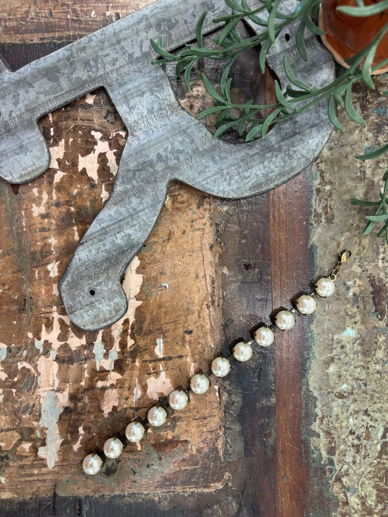 Faux pearls in antique brass