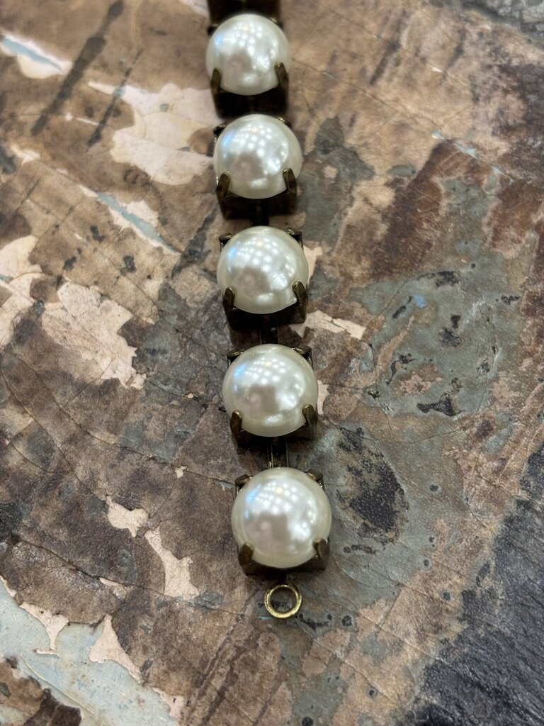 Faux pearls in antique brass