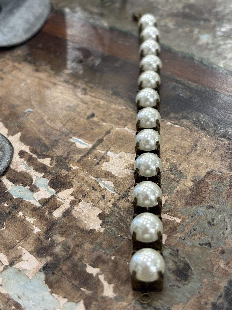Faux pearls in antique brass