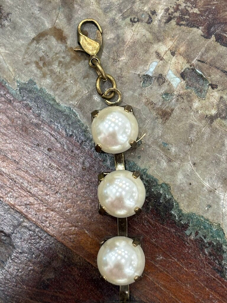 Faux pearls in antique brass