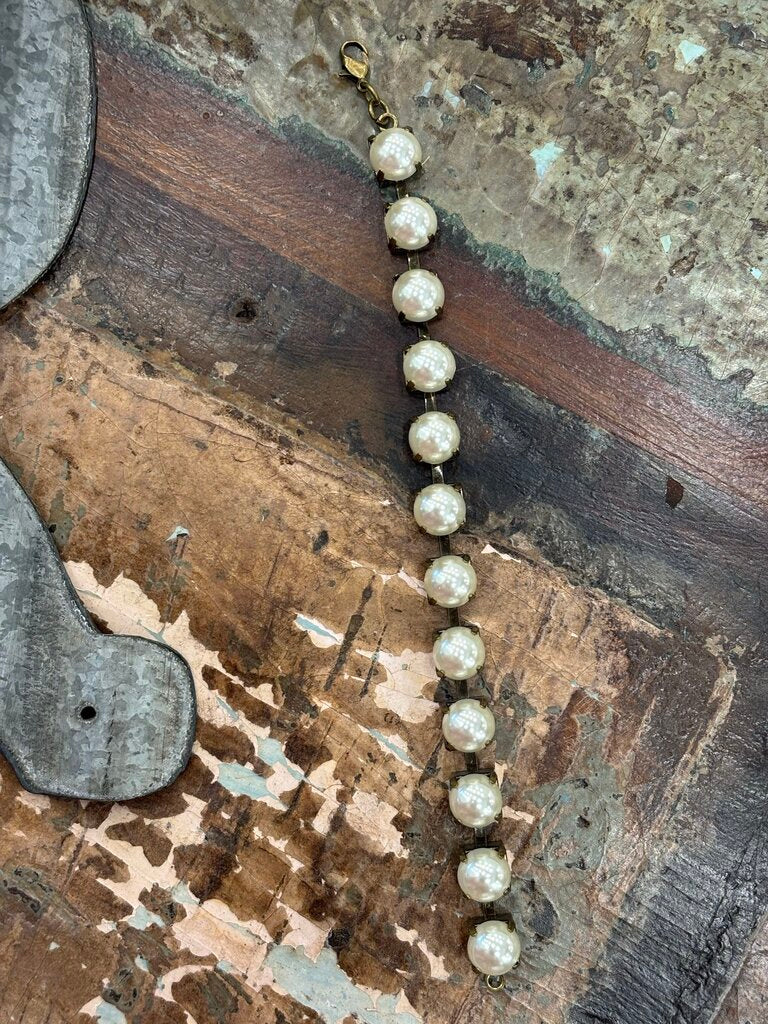 Faux pearls in antique brass