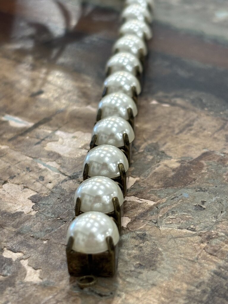 Faux pearls in antique brass